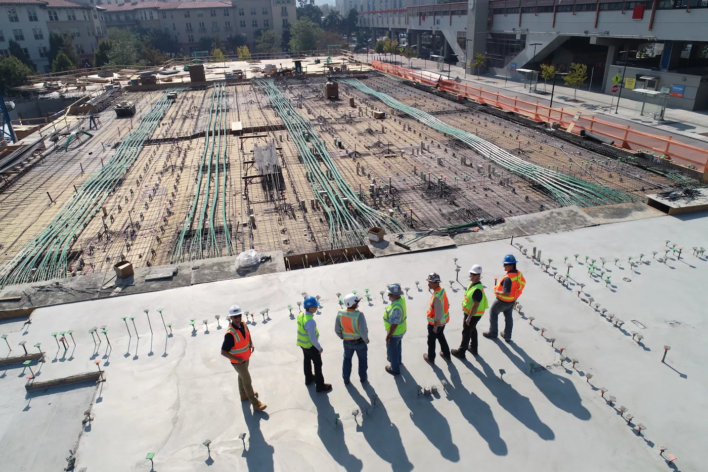 Construction workers managing fragmented site work